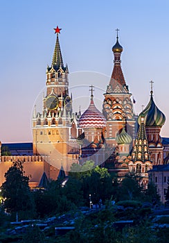 Cathedral of Vasily the Blessed Saint Basil`s Cathedral and Spasskaya Tower of Moscow Kremlin on Red Square at sunset, Moscow,