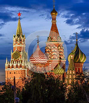 Cathedral of Vasily the Blessed and Spasskaya Tower of Moscow Kremlin on Red Square at sunset, Moscow,