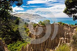 The Cathedrals eroded clay cliff of Gore Bay, NZ photo