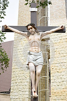 Catholic church and Jesus Christ on crucifix.