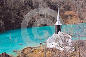 Catholic church and drowned cemetery. Waste lake with cyanide po