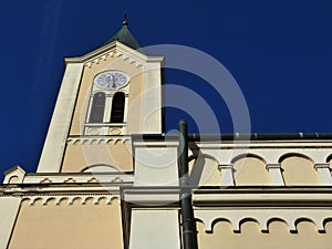 Catholic church exterior facade detail with clock tower