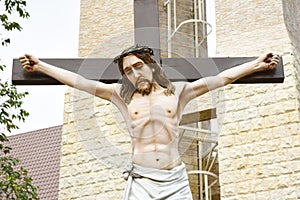 Catholic church and Jesus Christ on crucifix.