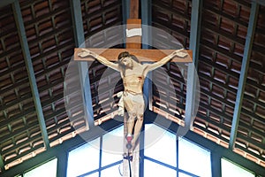 Catholic church and Jesus Christ on crucifix.
