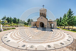 Catholic church and place with flags of countries involved in Korean war on the ground at Camp Bonifas in South Korea