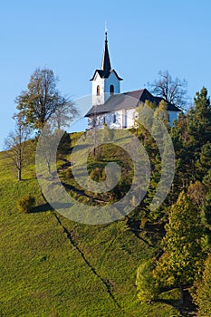 Catholic church of St. Jacob on top of the hill in Slovenia at early sunset