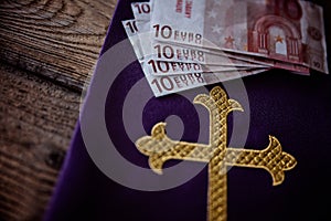 Catholic church symbols and Euro banknotes