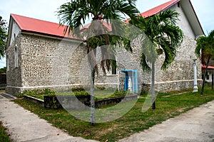 Catholic church and Virgin Mary statue in tropical garden. South Asia missionary parish. Catholic church spanish heritage