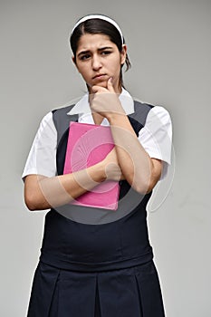 Catholic Colombian Girl Student Making A Decision With Notebook