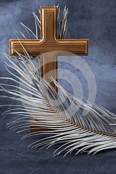 Catholic Cross with palm leaf. Ash Wednesday, Lent season, Holy Week, Good Friday and Palm Sunday concept.