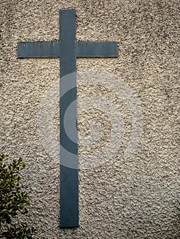 Catholic cross on a wall. Symbol of faith