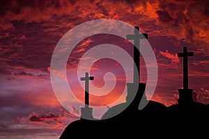 Catholic crosses silhouette with a darkness`s sunset background. We live in dangerous times, this Easter stay home and pray for th