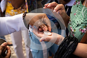 Catholic faithful receiving the host on the traditional first Friday of 2023 at the church of Senhor do Bonfim