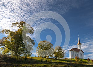 Catholic Monastery Manastirea Greco-Catolica from Basesti village in Maramures county, Romania, during an autumn sunset next to