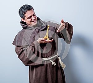 Catholic monk with Eiffel tower gift