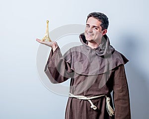 Catholic monk with Eiffel tower gift