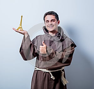 Catholic monk with Eiffel tower gift