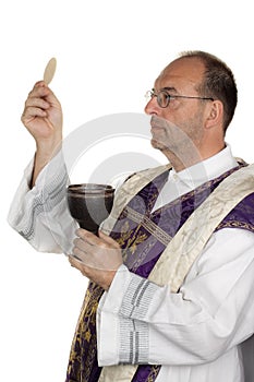 Catholic priest during communion in worship photo