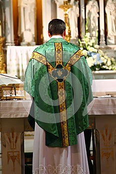 Catholic Priest facing altar