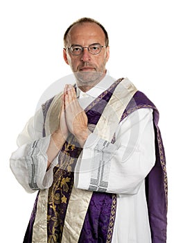 Catholic priests in prayer in worship