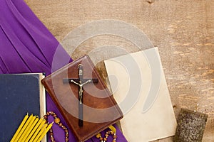 Catholic wooden crucifix on the prayer book