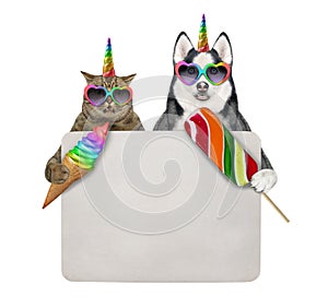 Caticorn and dogicorn eat ice cream near sign