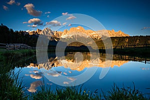 Catinaccio mountain lake reflection at sunset