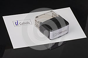 Catolic - checkbox with a tick on white paper with handle Rubber Stamper. Checklist concept