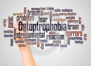 Catoptrophobia fear of mirrors word cloud and hand with marker concept