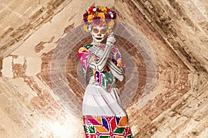 Catrina makeup. Young Mexican woman with typical costume