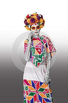 Catrina makeup. Young Mexican woman with typical costume