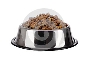 Cats and dogs dry food in a stainless steel bowl on a white background. Pet kibble food in bowl