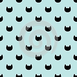 Cats heads seamless pattern. Blue and black graphic background.