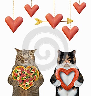 Cats holding heart shaped food 2