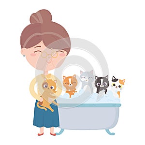 Cats make me happy, old woman bathing cats in bathtub