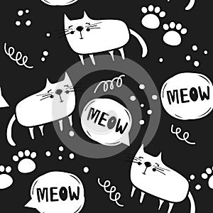 Cats and paw prints, black and white seamless pattern