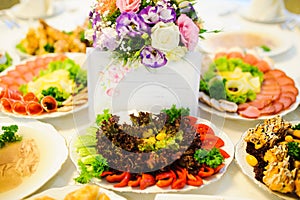 Cattering. Table full of food at a restaurant.