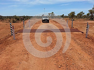 Cattle grid on gravel road in Australian Outback