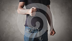 Caucasian angry man threatening with fist