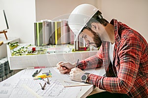 Young architect working on an office desk