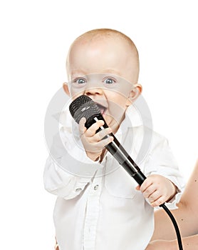 Caucasian baby boy with microphone
