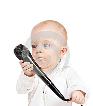 Caucasian baby boy with microphone