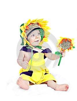 Caucasian baby boy in a sunflower fancy dress