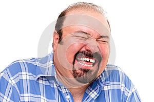 Caucasian bearded happy man laughing loud photo