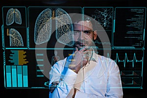 Caucasian bearded man looks at the medical screen of the respiratory system. HUD menu.