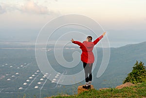 Caucasian beautiful woman stand with raise her arm up and action of happy with laughing with white sky as background