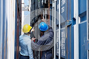 Caucasian and Black Inspectors  Inspecting the Containers