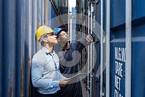 Caucasian with Black Inspectors Inspecting the Containers at the Port