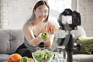 Caucasian blogger woman make vlog how to diet and lost weight. Lifestyle, influencer women, healthy concept.