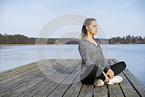 Caucasian blonde Scandinavian fitness girl training outdoors in Sweden